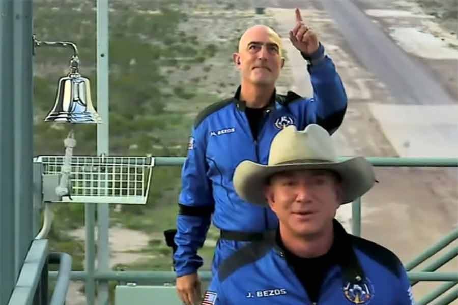 Billionaire Jeff Bezos, founder of ecommerce company Amazon.com Inc, and his brother Mark board ahead of their scheduled flight aboard Blue Origin's New Shepard rocket near Van Horn in Texas of the United States on Tuesday. The still image was captured from a video. -Reuters Photo
