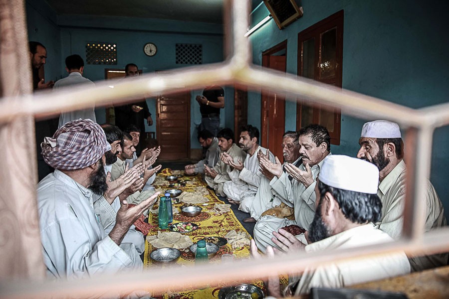 Kabuliwalas in Kolkata are praying before their meal in 2015. They used to dine on the dastarkwhan —Scroll.In Photo