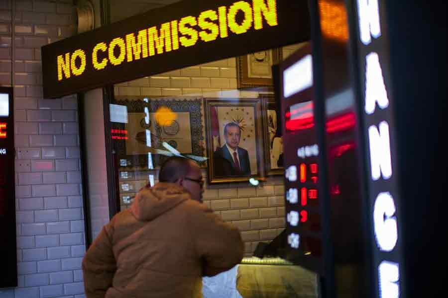 A portrait of Turkey's President Recep Tayyip Erdogan hanging in a money exchange shop in Istanbul of Turkey on Monday –AP Photo
