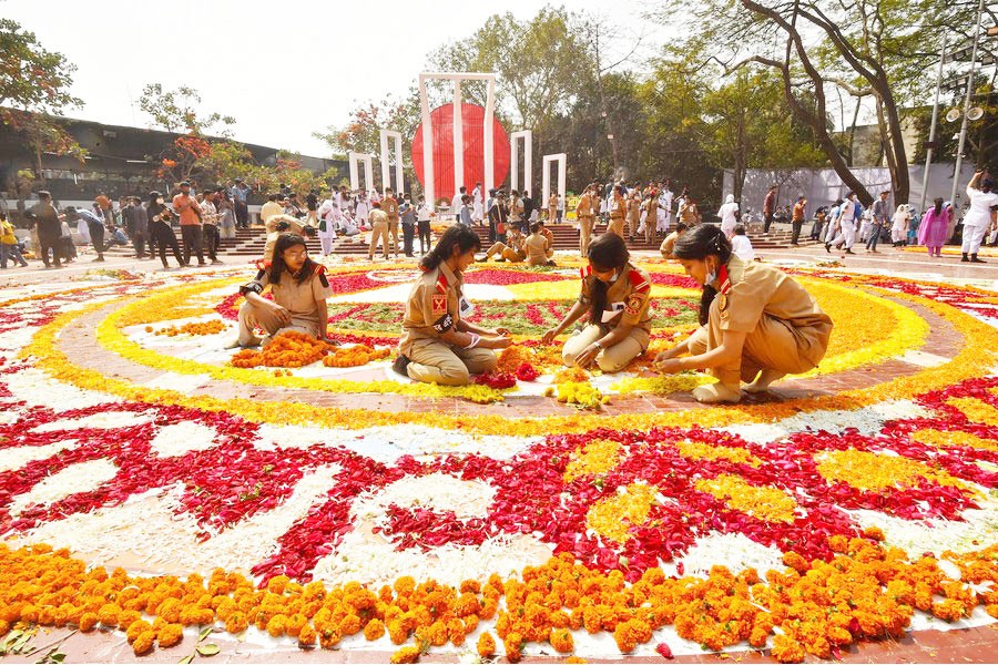 Volunteers arrange the decoration in front of the language martyrs' memorial monument in Dhaka, Bangladesh, Feb. 21, 2021. —Xinhua Photo
