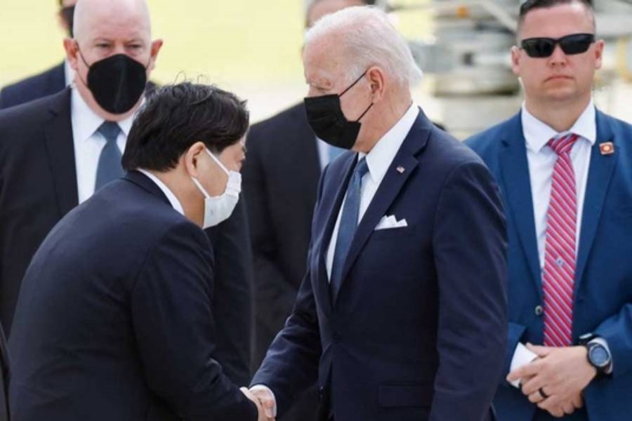 US President Joe Biden shakes hands with Japanese Foreign Minister Yoshimasa Hayashi upon his arrival Japan May 22, 2022. (Reuters)