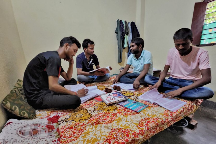 Government job aspirants Rahul Patel, Prem Prakash, Ravi Ranjan and Gupteshwar Kumar take part in a group study as they prepare for examinations for railway jobs in a rented room in Arrah, in the eastern state of Bihar, India, June 25, 2022. REUTERS/Saurabh Sharma