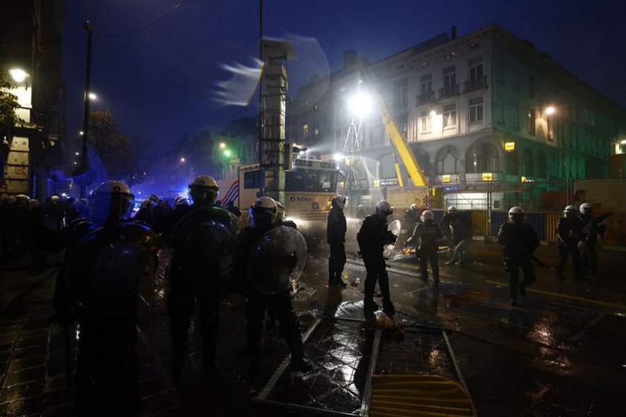 Police officers take positions during clashes in Brussels after the World Cup match between Belgium and Morocco on November 27, 2022 — Reuters photo