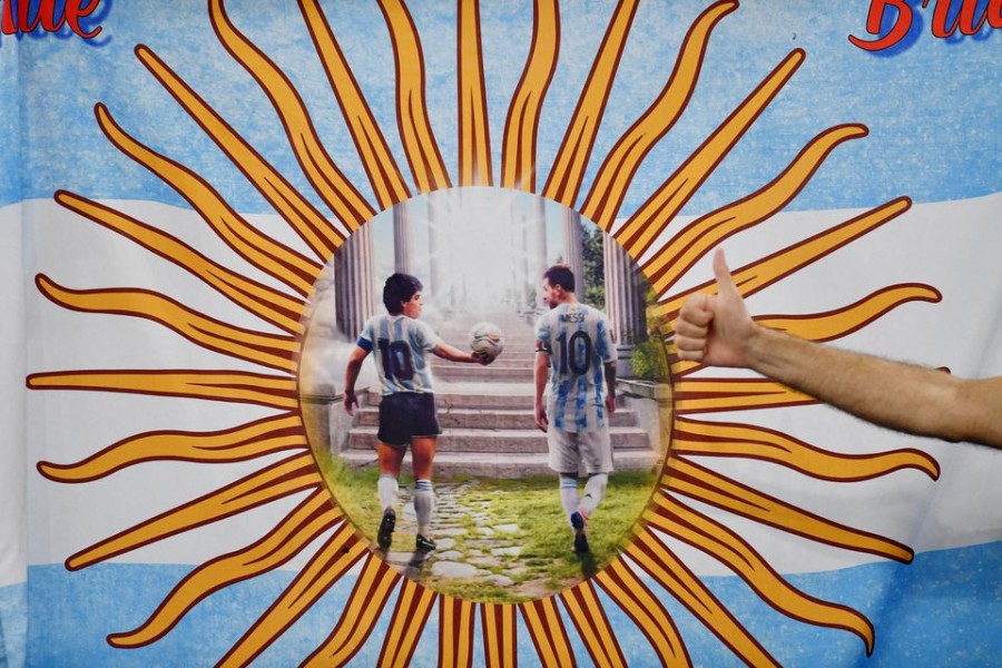 A flag with a picture of Argentina's Diego Maradona and Lionel Messi — Reuters/Files
